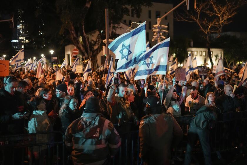 Demonstrators protest against Israeli Prime Minister Benjamin Netanyahu and call for new elections in the latest weekly protest against his handling of the Israel-Hamas war, in Tel Aviv, Israel, Saturday, Feb. 17, 2024.(AP Photo/Leo Correa)