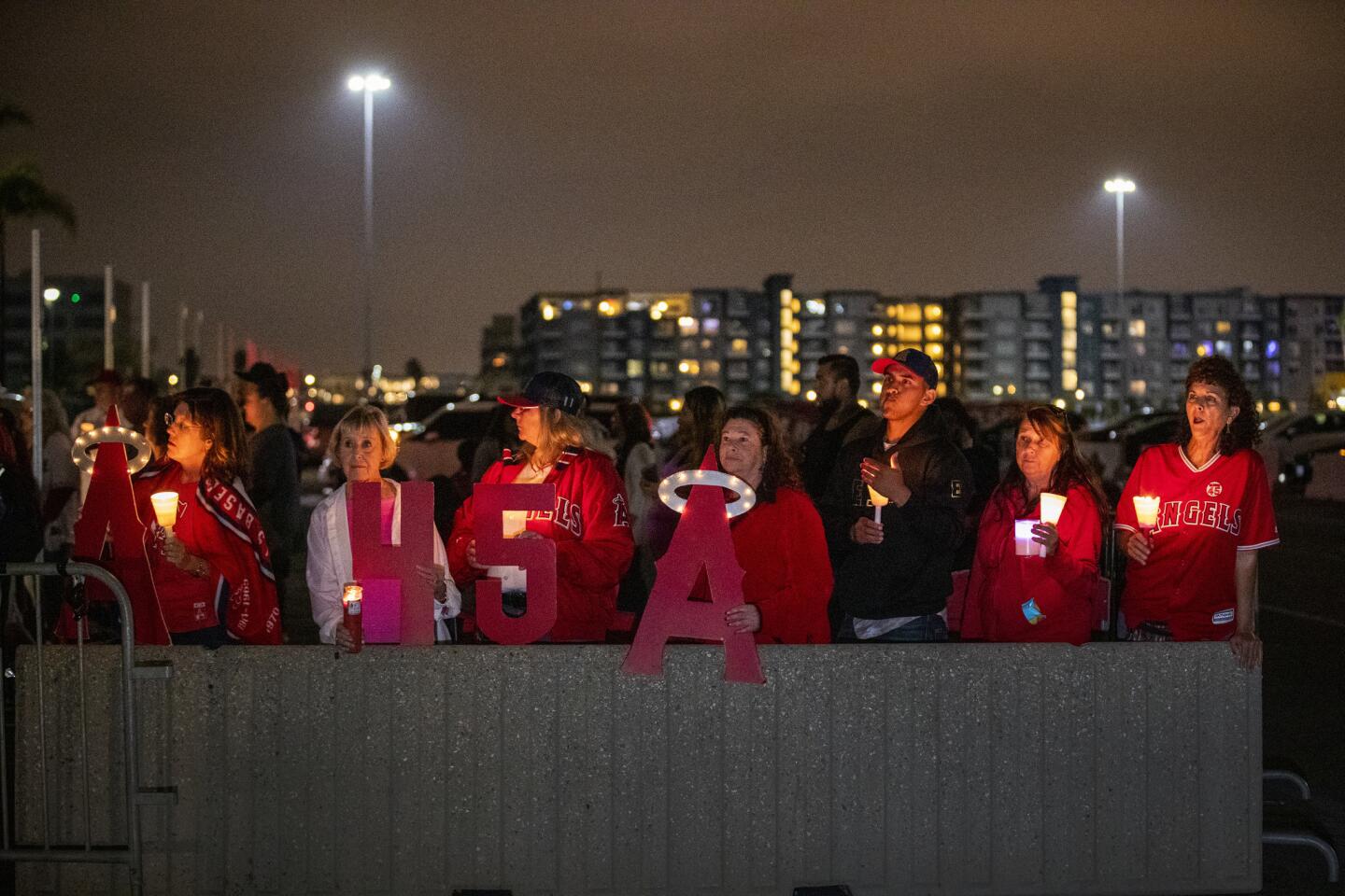 Fans hold a vigil for Angels pitcher Tyler Skaggs at Angel Stadium on July 7. Skaggs was found dead in a Texas hotel room on July 1.