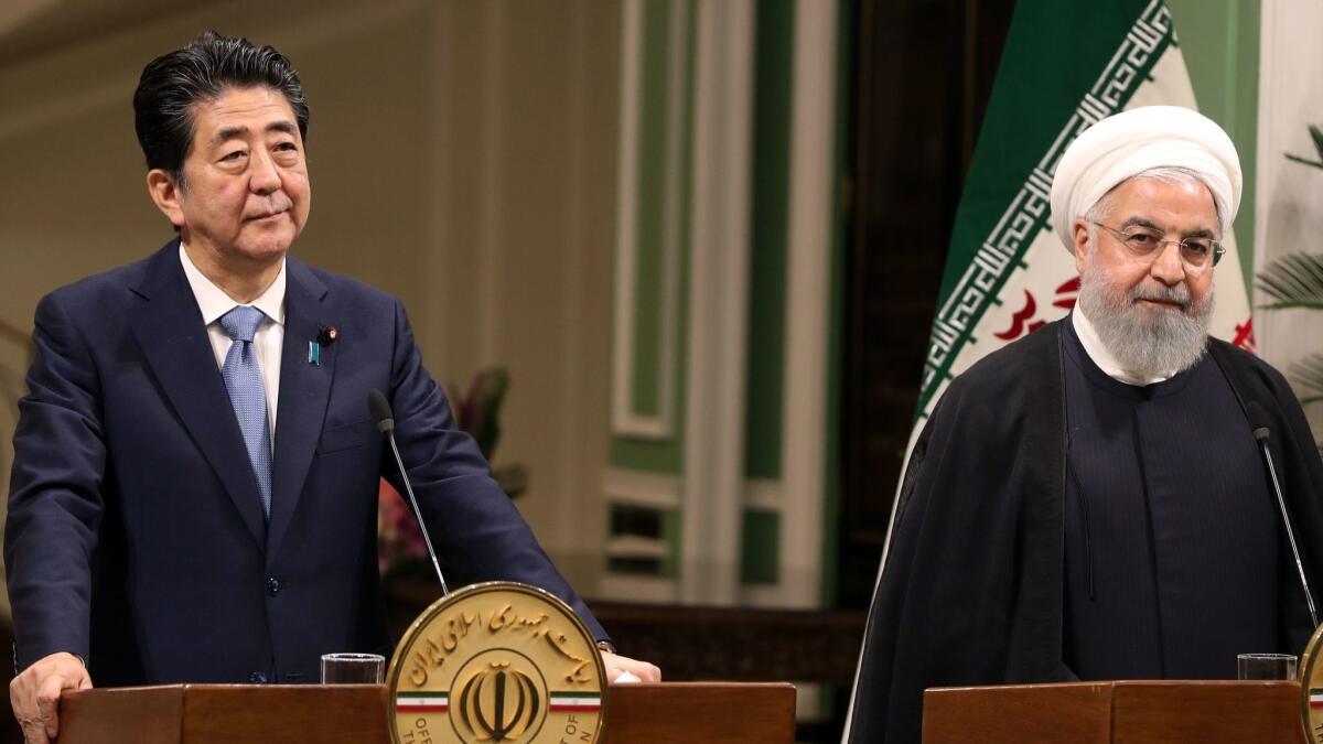 Japanese Prime Minister Shinzo Abe and Iranian President Hassan Rouhani at a joint news conference in Tehran on June 12.