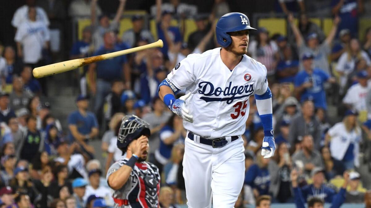 Cody Bellinger flips his bat after hitting a solo home run during the sixth inning of a 5-1 victory over the San Diego Padres at Dodger Stadium on Thursday.