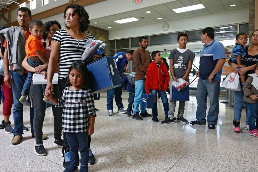 Mandatory Credit: Photo by LARRY W. SMITH/EPA-EFE/REX/Shutterstock (9728125f) Migrant families are processed at the Central Bus Station before being taken to Catholic Charities before being removed in McAllen, Texas, USA, 26 June 2018. Immigration along the Rio Grande in Texas has become a political issue, due to the controversy surrounding the US Justice Department's suspended 'Zero Tolerance' policy of criminally prosecuting all migrants entering the country illegally and the now-reversed policy of separating migrant children from their parents. Immigration along the Texas Mexico border, Mcallen, USA - 20 Jun 2018 ** Usable by LA, CT and MoD ONLY **