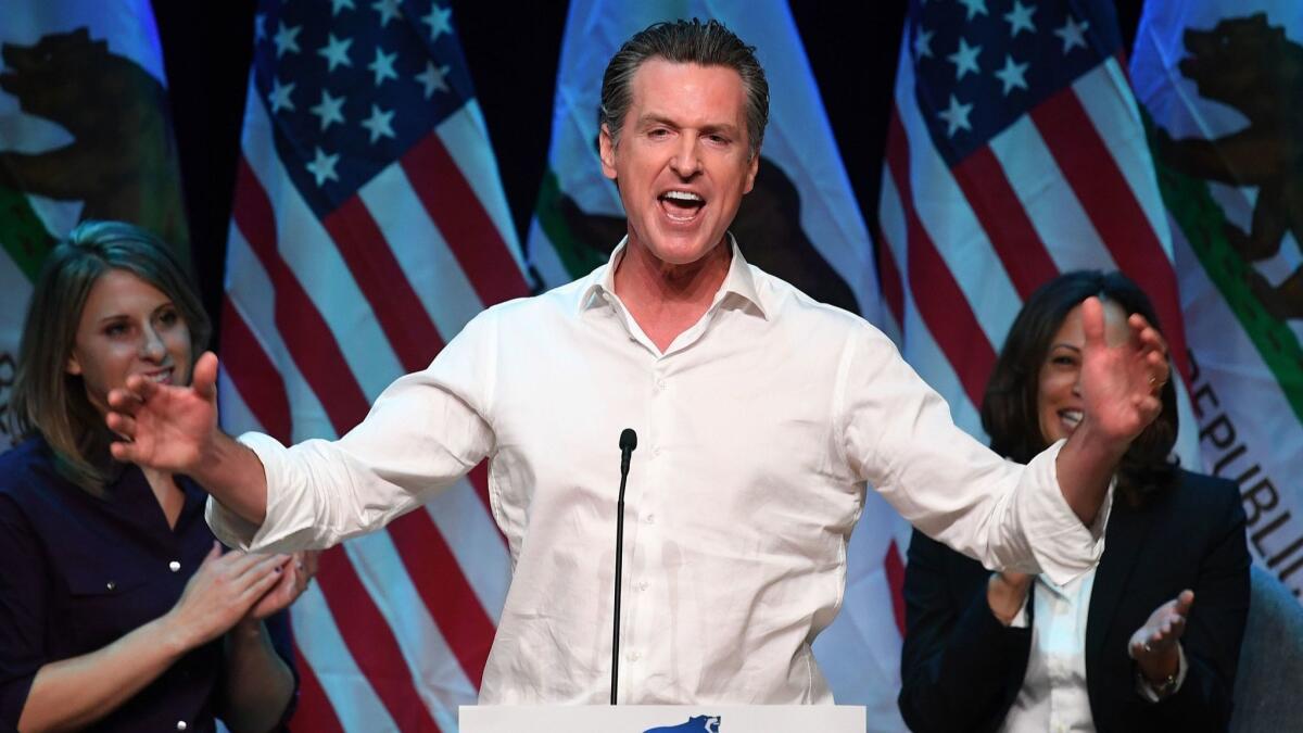 California Gov.-elect Gavin Newsom speaks to the crowd at a campaign rally in Santa Clarita before the midterm election.
