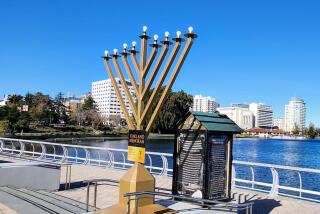 Oakland's Jewish community celebrated the official lighting of the city's largest menorah at Lake Merritt on Dec. 10.
