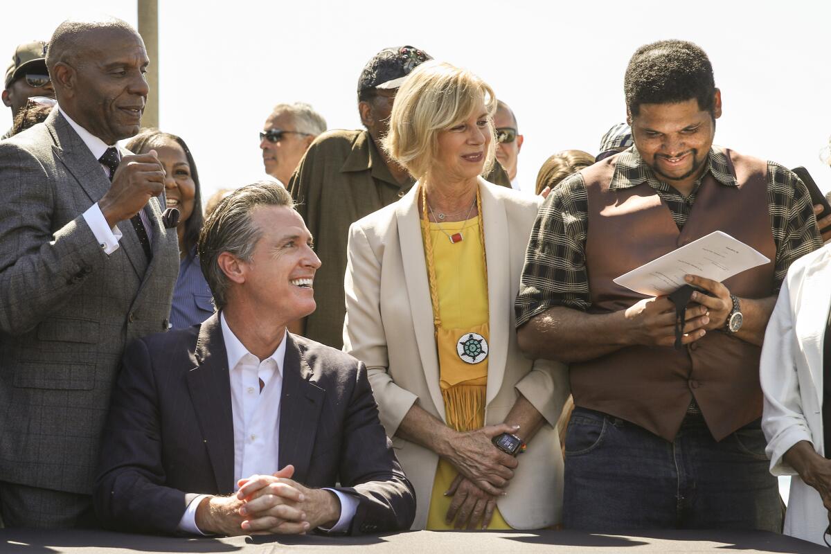 From left, Sen. Steven Bradford, Gov. Newsom, Supervisor Janice Hahn and Anthony Bruce