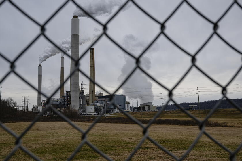 LOUISVILLE, KENTUCKY - FEBRUARY 14: The flue-gas stacks of Mill Creek Generating Station, a coal-fired power plant, are seen from the Valley Village neighborhood on February 14, 2026 in Louisville, Kentucky. President Donald Trump and Environmental Protection Agency Administrator Lee Zeldin revoked the EPA's 2009 "endangerment finding," which concluded that carbon dioxide and other greenhouse gases endanger human health and the environment and underpin federal efforts to regulate emissions. (Photo by Jon Cherry/Getty Images)