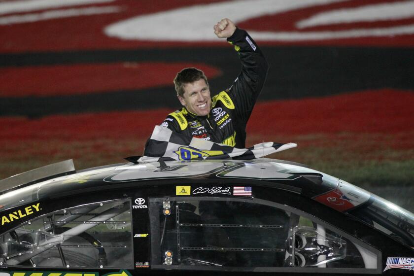 Carl Edwards celebrates after winning the Coca-Cola 600 on Sunday at Charlotte Motor Speedway.