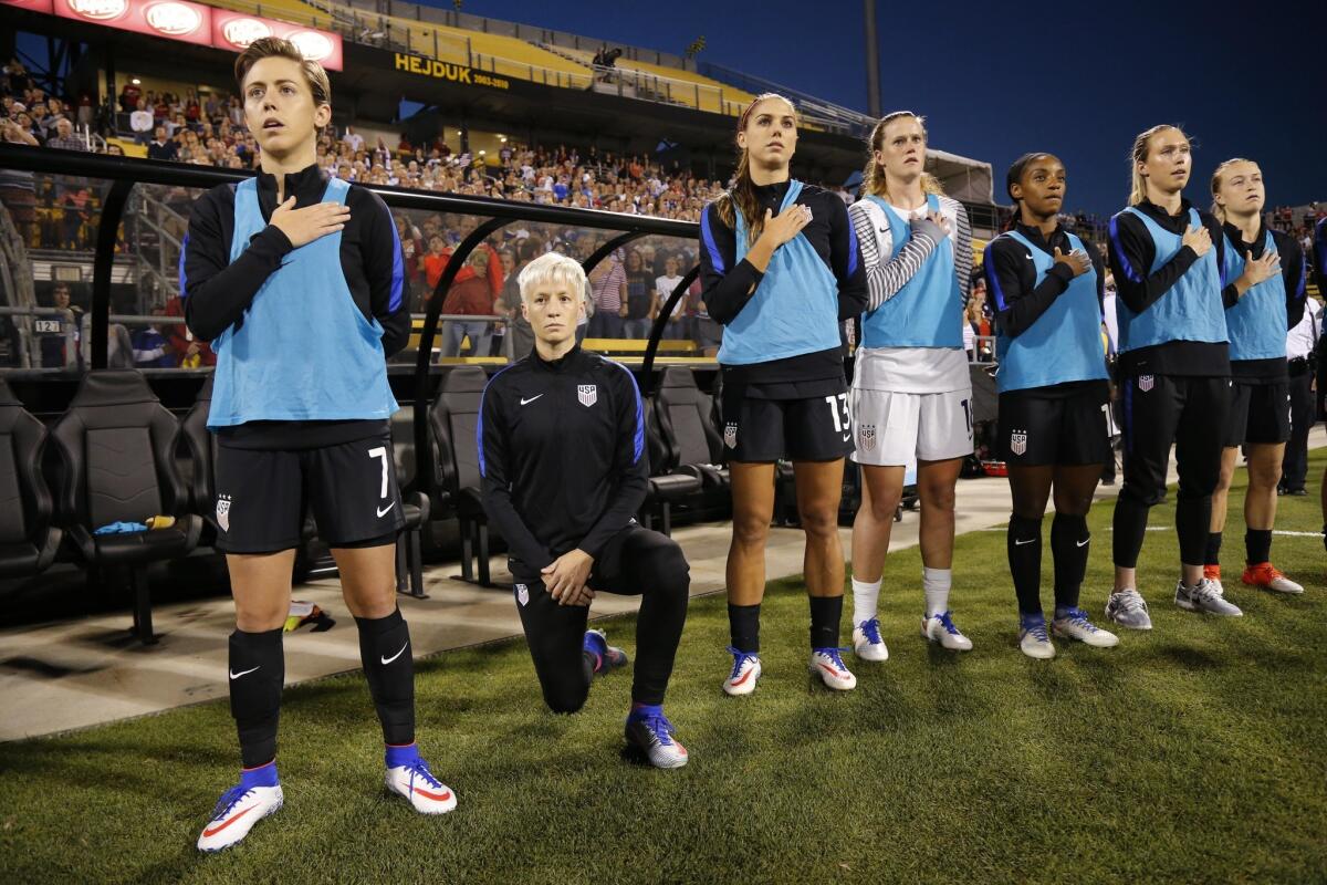 Megan Rapinoe of the U.S. kneels during the playing of the national anthem before the soccer match against Thailand.