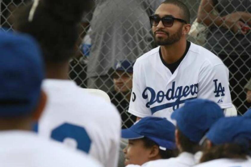 Matt Kemp looks out to a group of school kids all wearing Dodger blue at the dedication of the Dodger Dreamfield at Mona Park in Compton on Nov. 14.