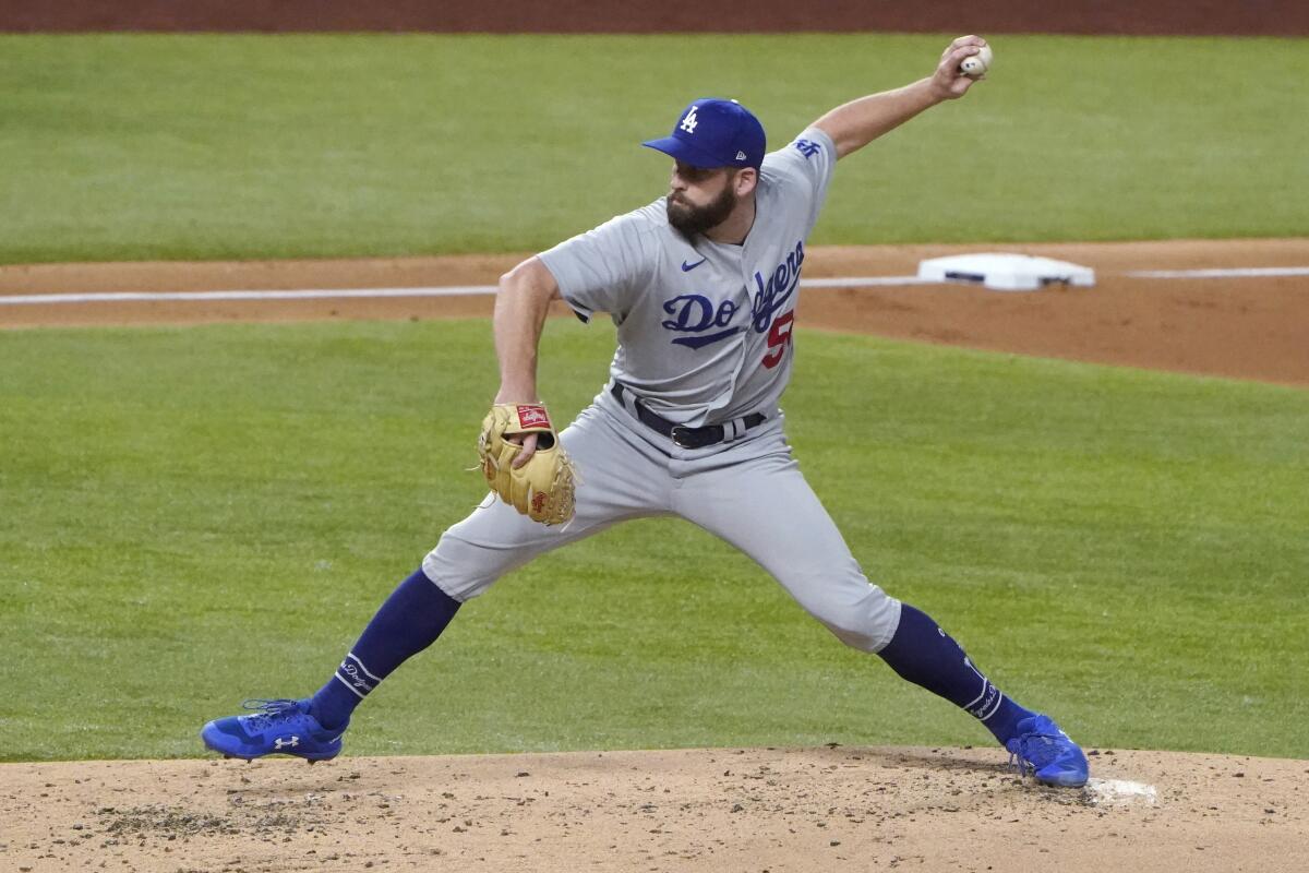 Dodgers pitcher Adam Kolarek delivers against the San Diego Padres.
