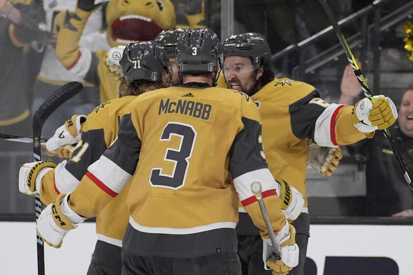 Vegas Golden Knights right wing Mark Stone, right, celebrates after scoring against the Dallas Stars during the third period in Game 6 of an NHL hockey Stanley Cup first-round playoff series Friday, May 3, 2024, in Las Vegas. (AP Photo/John Locher)