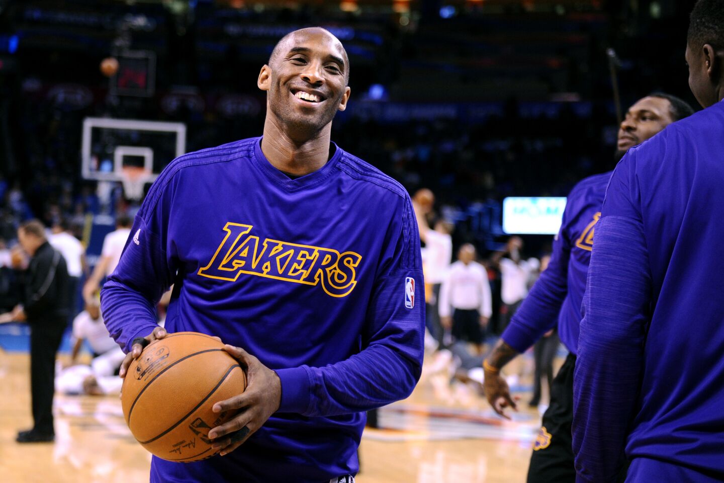 Kobe Bryant laughs with teammates before a game against the Thunder in Oklahoma City on April 11.