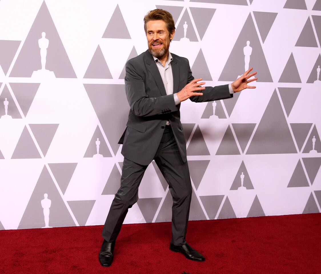 Actor Willem Dafoe, nominated for his role in "The Florida Project," shimmies across the red carpet en route to the nominees luncheon for the 90th Oscars in the Grand Ballroom at the Beverly Hilton.