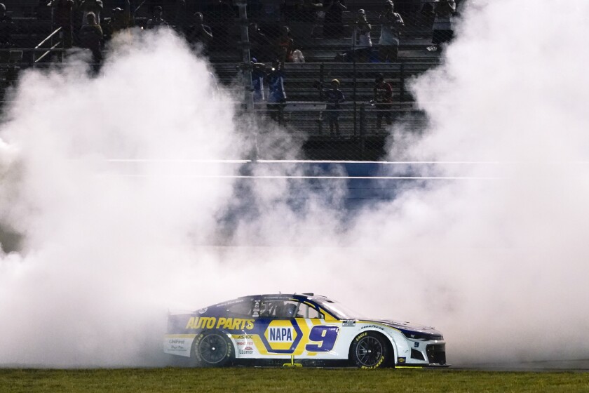 Chase Elliott does a burnout after winning a NASCAR Cup Series auto race Sunday, June 26, 2022, in Lebanon, Tenn. (AP Photo/Mark Humphrey)