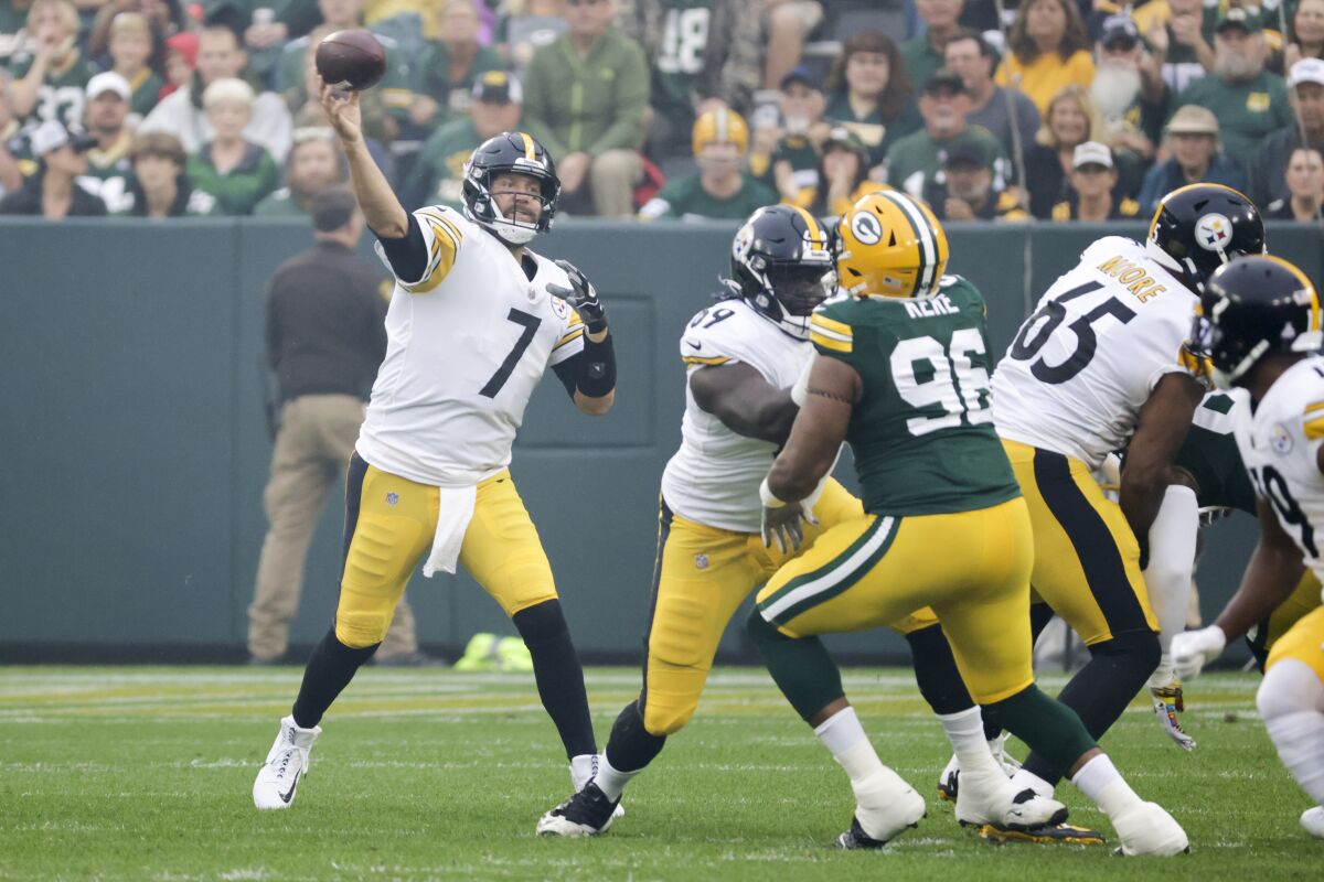 Pittsburgh Steelers' Ben Roethlisberger thorws during the first half of an NFL football game against the Green Bay Packers Sunday, Oct. 3, 2021, in Green Bay, Wis. (AP Photo/Mike Roemer)