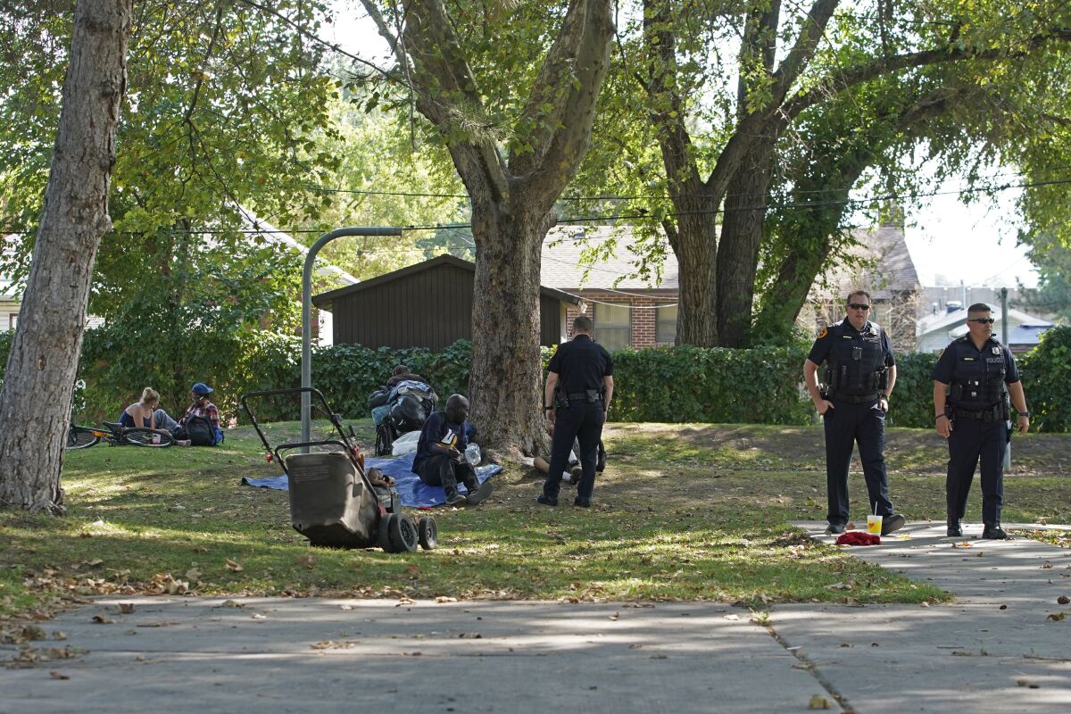 Salt Lake City police in a park where homeless people tend to camp.