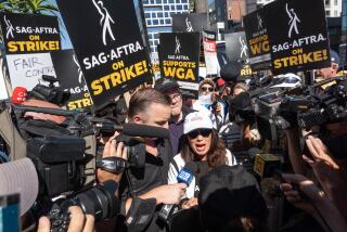 LOS ANGELES, CA - JULY 14: SAG-AFTRA President Fran Drescher faces a media scrum at her appearance at the Netflix picket line in Los Angeles, CA on Friday, July 14, 2023. Actors join striking writers who have been on the picket lines since the beginning of May. (Myung J. Chun / Los Angeles Times)