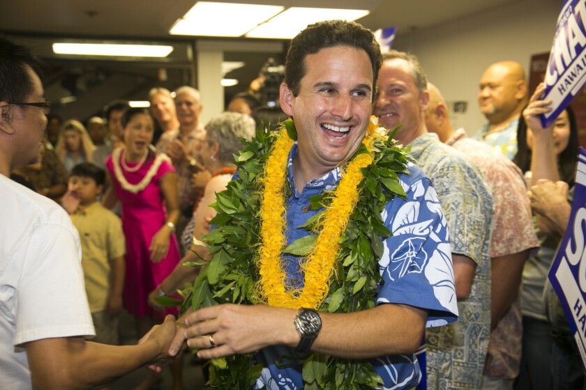 Sen. Brian Schatz, greeted by supporters after Saturday's primary, holds a narrow lead over challenger Rep. Colleen Hanabusa. The race will be decided in a special two-precinct vote Friday.
