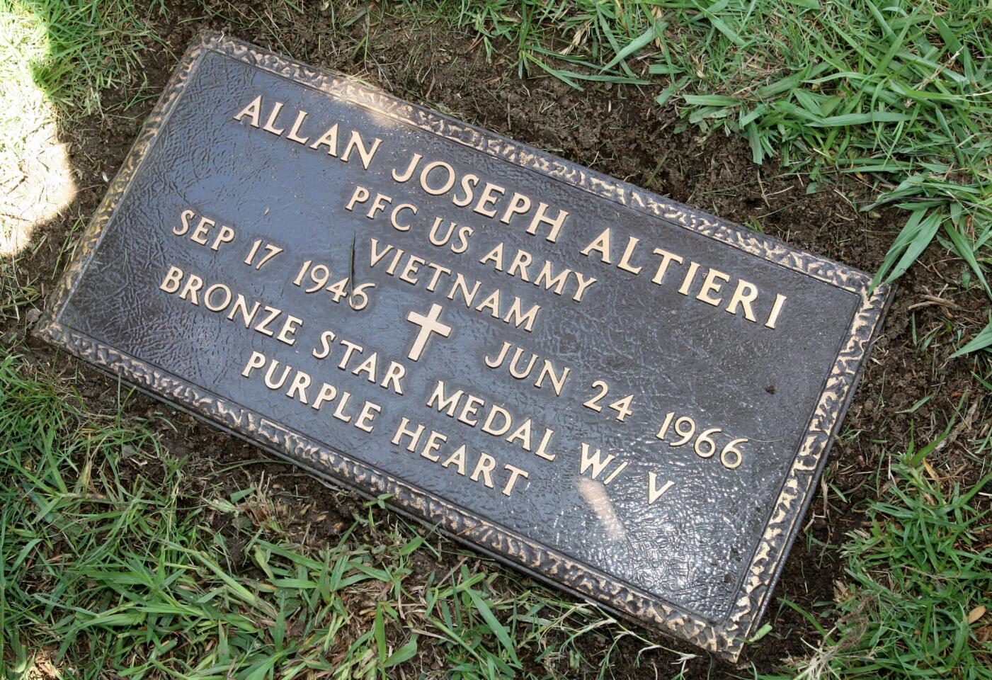 A plaque has been installed at the unmarked grave site for Glendale resident and US Army PFC Allan J. Altieri 50 years to the day after he was killed in Vietnam, at San Fernando Mission Cemetery in Mission Hills on Friday, June 24, 2016. PFC Altieri, a graduate of Glendale High School, died at age 19 during a battle in Vietnam. His family moved to the East Coast after Altieri died because, according to a friend, his parents couldn't take the loss.