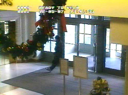 This image taken from a video surveillance camera and released by the Omaha Police Department Robert A. Hawkins walking into the Westroads Mall moments before killing eight people and himself.