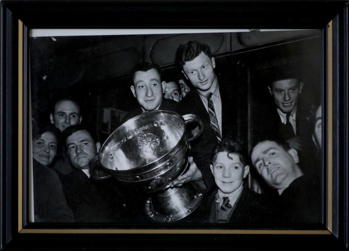 Padraig Carney, center right, poses with the Sam Maguire Cup in 1951.