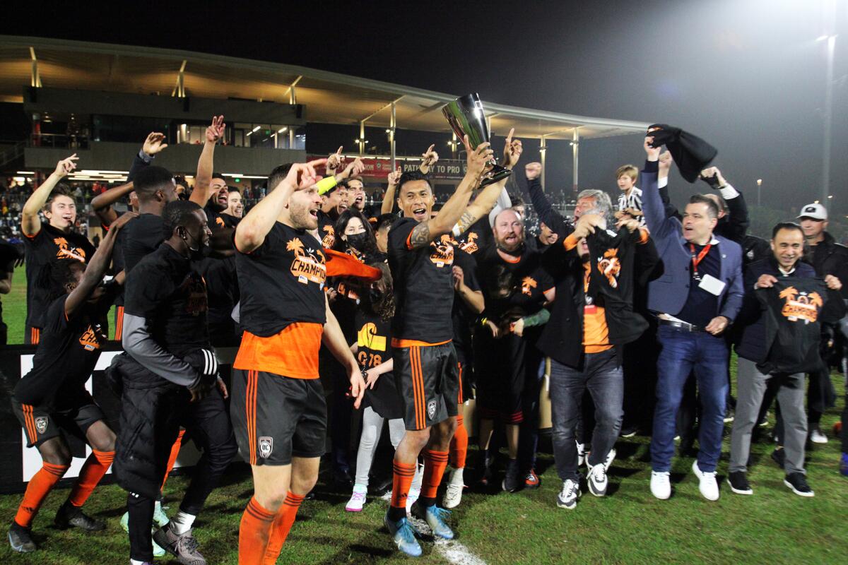 Orange County Soccer Club celebrates after winning the Western Conference finals of the United Soccer League Championship.