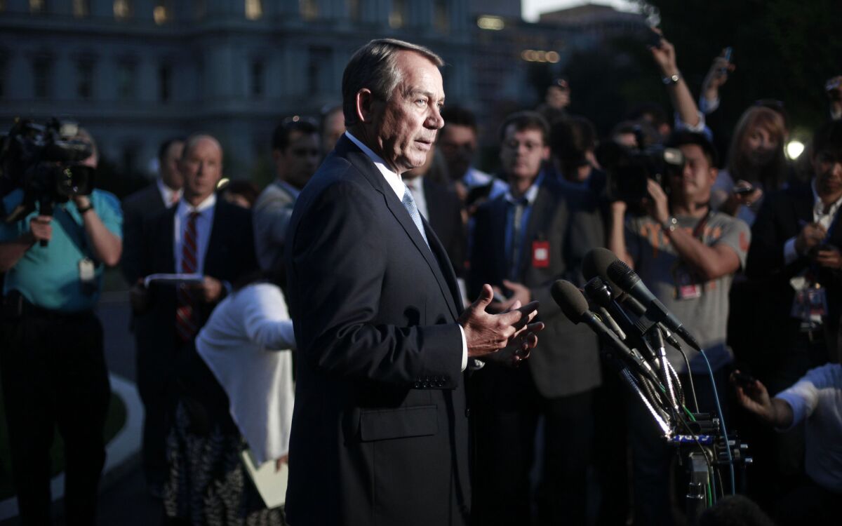 House Speaker John A. Boehner (R-Ohio) speaks to the media after meeting with President Obama at the White House on Wednesday to discuss the budget impasse. Boehner has pointed to the number of waivers granted to provisions of the Affordable Care Act as grounds to defund it.