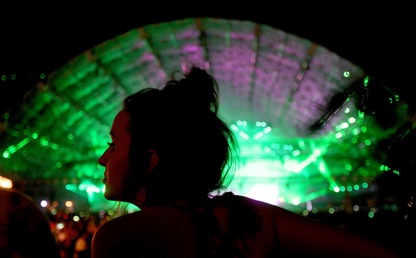 INDIO, CALIF. - APRIL 15, 2017. A woman dances the night away at the Sahara Stage on day two of the Coachella Music and Arts Festival in Indio on Saturday, April 15, 2017. (Luis Sinco/Los Angeles Times)