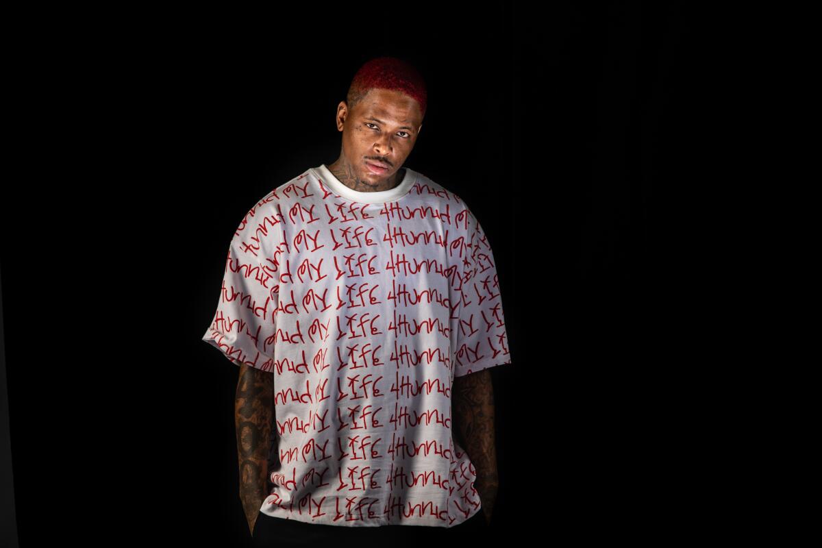 Rapper YG in a tee from his company in promotion of his new album, "My  Life 4Hunnid."