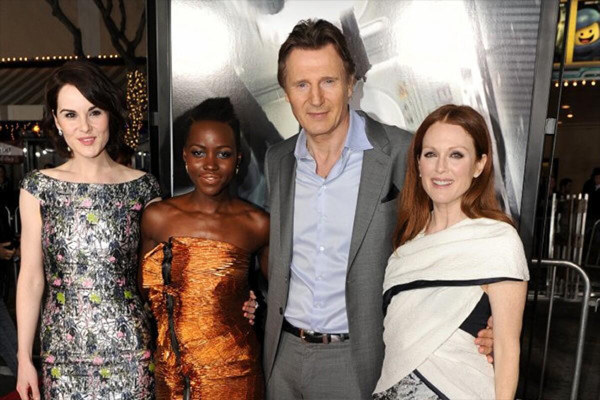 Actors Michelle Dockery, Lupita Nyong'o, Liam Neeson and Julianne Moore attend the premiere of Universal Pictures and Studiocanal's "Non-Stop" at Regency Village Theatre in Westwood.