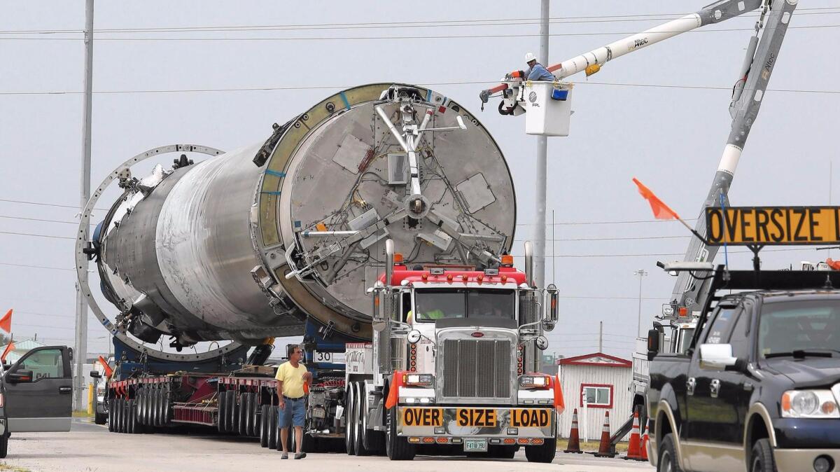 SpaceX moves the first stage of a Falcon 9 rocket from Port Canaveral in Florida on June 6.