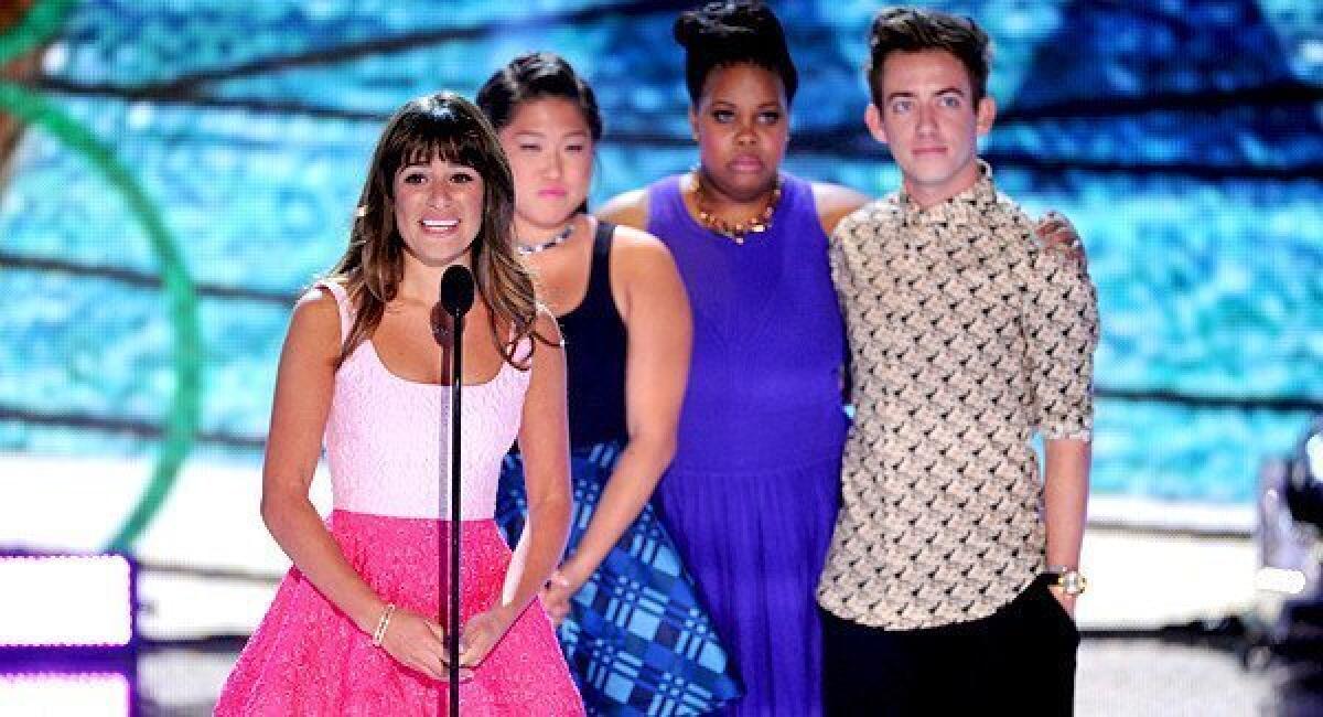Actors Lea Michele, Jenna Ushkowitz, Amber Riley and Kevin McHale accept Choice TV Show: Comedy award for "Glee" onstage.