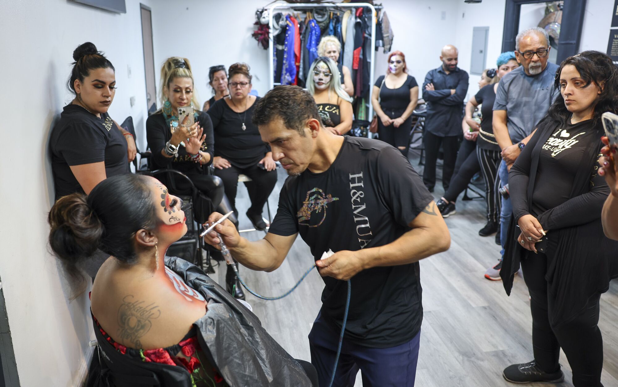 Ruben Lopez, senior artist and co-owner of H&MUA Studio, teaches a makeup school 