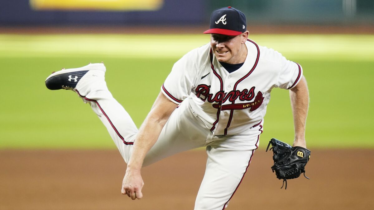 Atlanta Braves' Mark Melancon delivers a pitch during the ninth inning in Game 1.