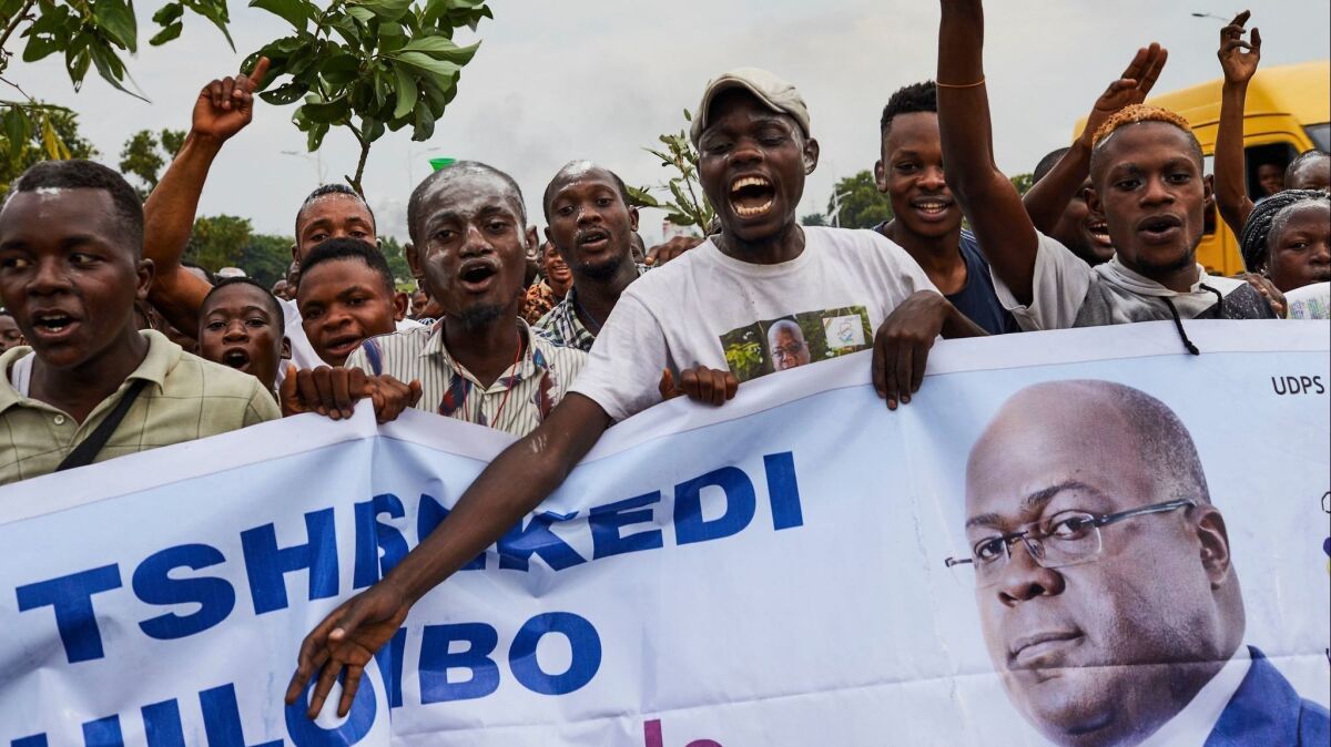 Supporters of opposition leader Felix Tshisekedi celebrate Thursday in Kinshasa, Congo, after he was declared the winner of the presidential election.