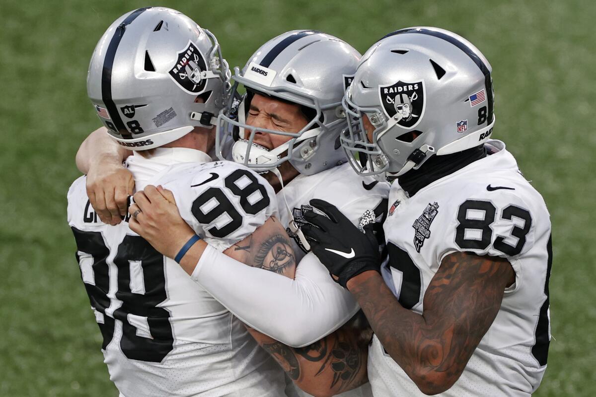 Darren Waller of the Las Vegas Raiders celebrates a touchdown with