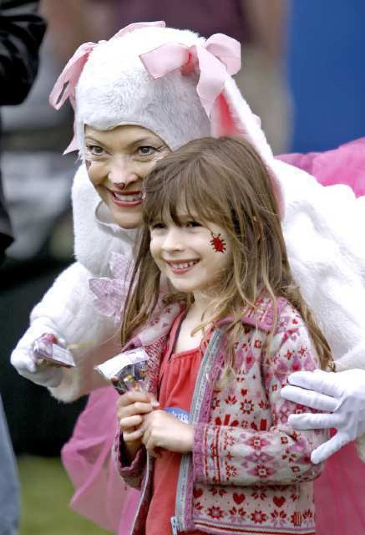 Matisse Anderson, 4 of Los Angeles, poses with Easter Bunny Rowena Emmett during the Annual Dilbeck Real Estate Easter in the Park at Memorial Park in La Canada Flintridge in 2011. Festivities included egg hunts, hat parade, games, prizes and a stage show.