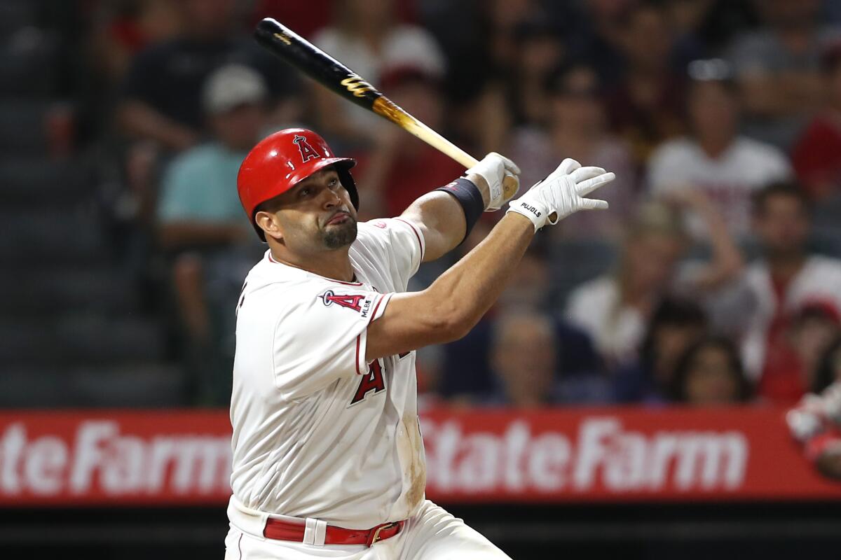 Angels slugger Albert Pujols hits during a game.