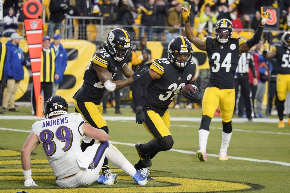 Pittsburgh Steelers free safety Minkah Fitzpatrick (39) celebrates after he intercepted a pass to Baltimore Ravens tight end Mark Andrews (89) during the first half of an NFL football game, Sunday, Dec. 5, 2021, in Pittsburgh. (AP Photo/Gene J. Puskar)
