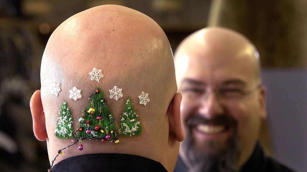 Steve Schaak shows the Christmas trees, complete with tiny lights, decorating his head in 2006, in Billings, Mont.
