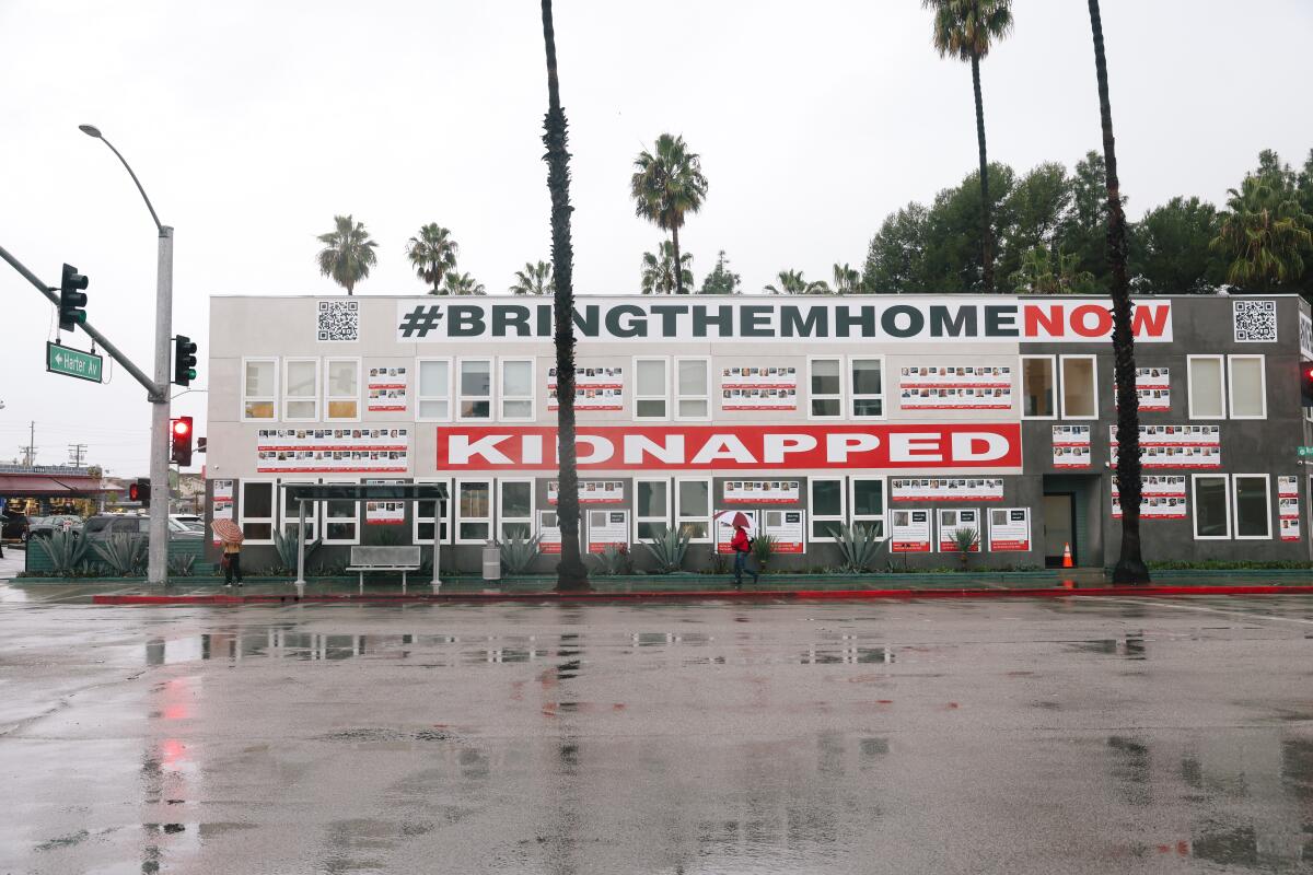 A mural reading "Kidnapped" and "Bring them home now."