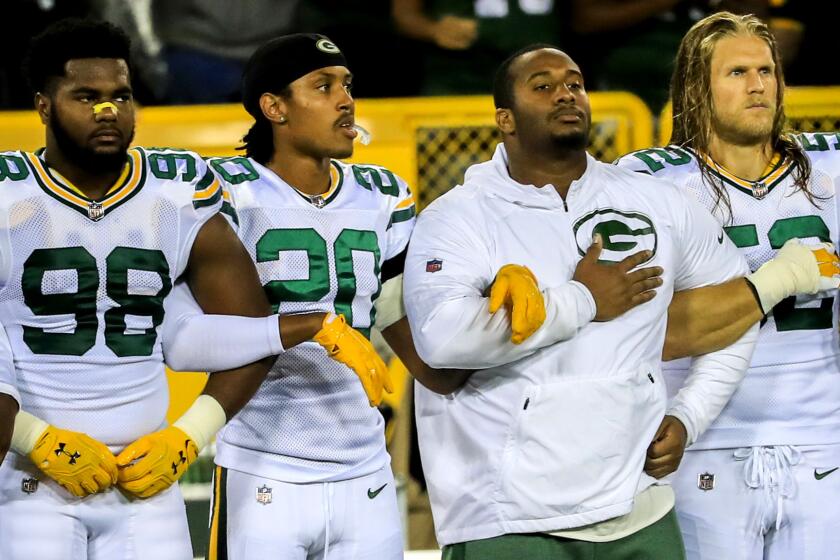 Mandatory Credit: Photo by TANNEN MAURY/EPA-EFE/REX/Shutterstock (9097533a) Chris Odom, Kevin King and Clay Matthews Chicago Bears at Green Bay Packers, USA - 28 Sep 2017 Members of the Green Bay Packers team and coaches including Green Bay Packers linebacker Chris Odom (L) Green Bay Packers cornerback Kevin King (2-L) and Green Bay Packers outside linebacker Clay Matthews (R) stand together with arms locked together before the start of their American Football game against the Chicago Bears at Lambeau Field in Green Bay, Wisconsin, 28 September 2017. ** Usable by LA, CT and MoD ONLY **