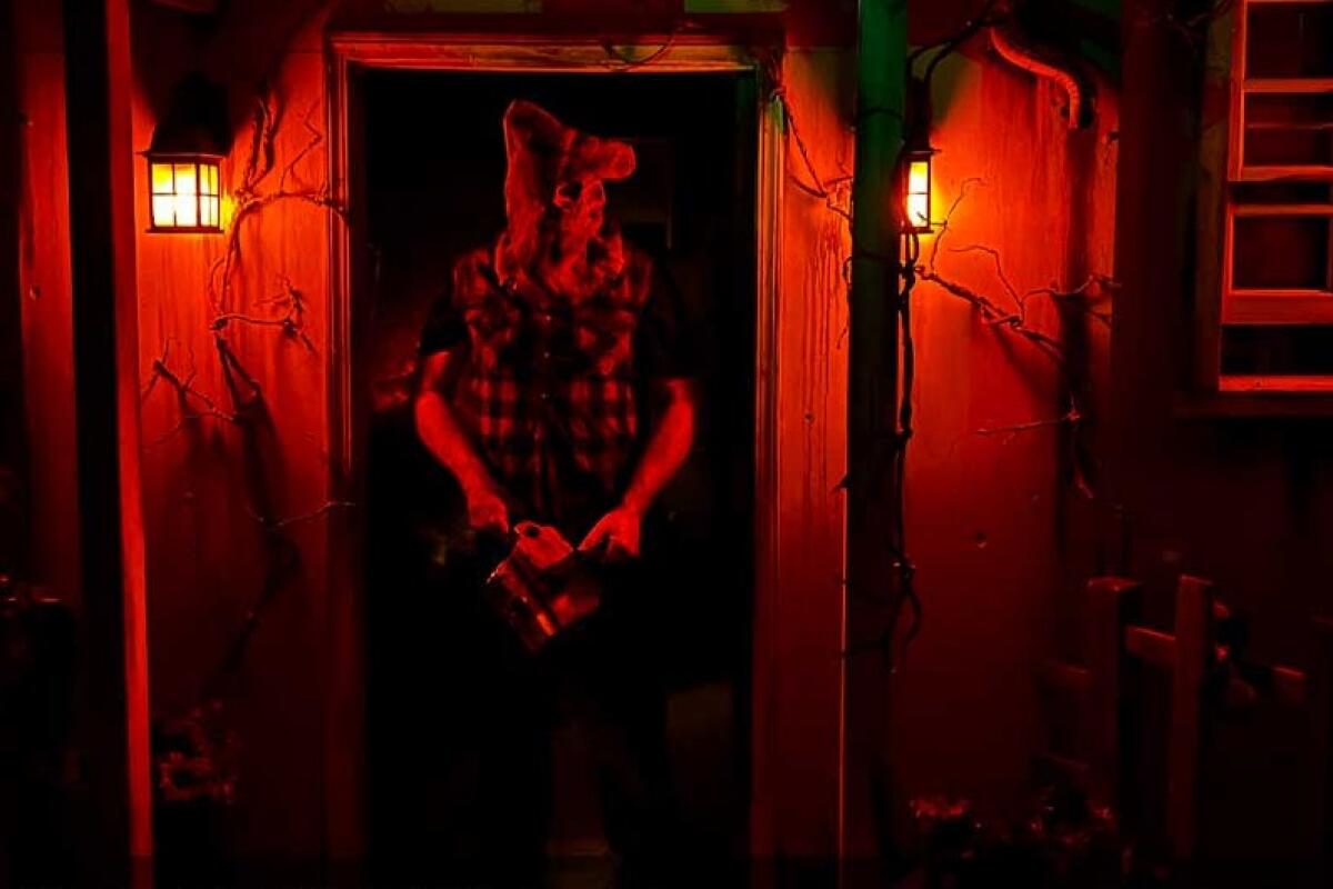 A creepy masked man with a chainsaw