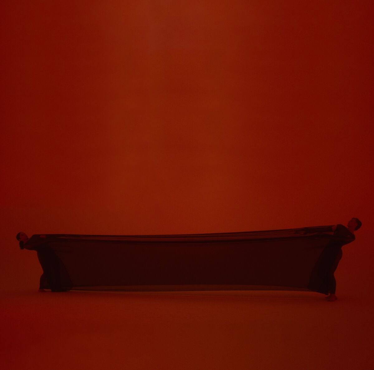 A bench in dark-red lighting 