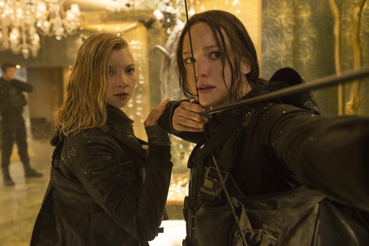 Natalie Dormer as Cressida, left, and Jennifer Lawrence as Katniss Everdeen in "The Hunger Games: Mockingjay -- Part 2."