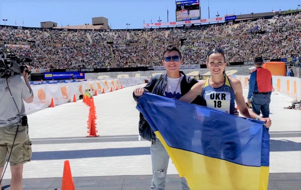 Filmmaker and musician Andres Useche with Ukrainian runner Valentyna Veretska following a race in Boulder, Colo.