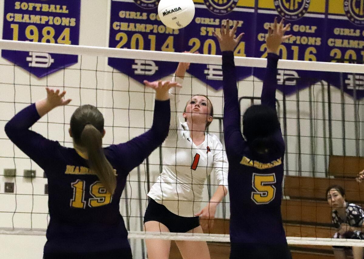 Pacifica Christian's Emma Hartman (1) hits a roll shot against Diamond Bar on Thursday.