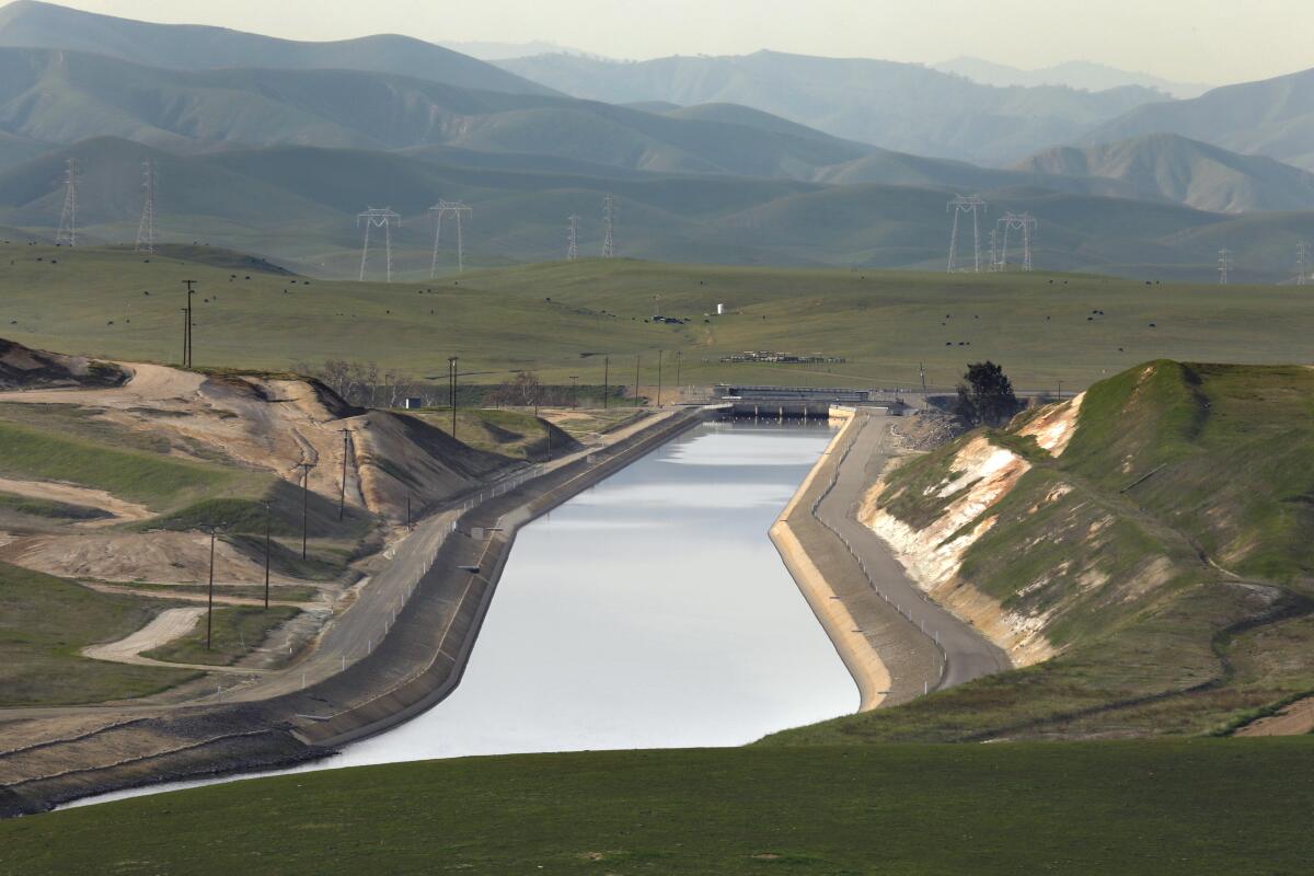 A canal carries water through the San Joaquin Valley.