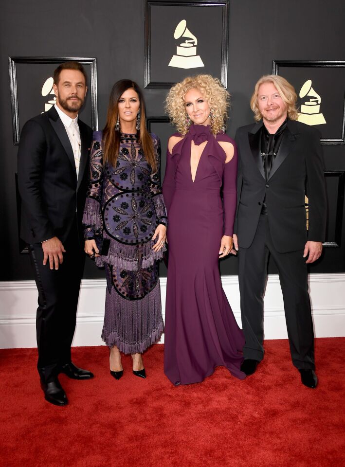 From left, Jimi Westbrook, Karen Fairchild, Kimberly Schlapman and Philip Sweet of Little Big Town arrive at the 59th Grammy Awards.