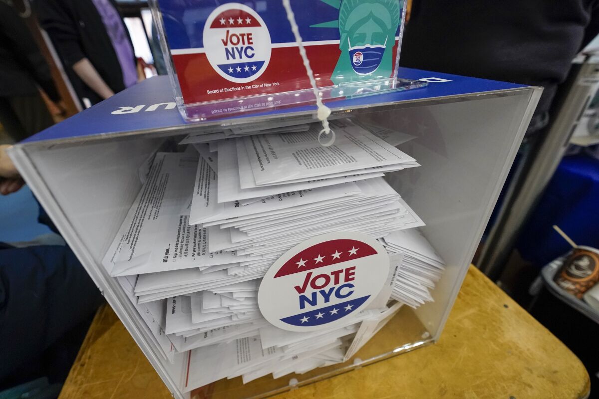 Absentee ballots are seen in a locked ballot box during early voting at the Park Slope Armory YMCA, Tuesday, Oct. 27, 2020, in the Brooklyn borough of New York. (AP Photo/Mary Altaffer)