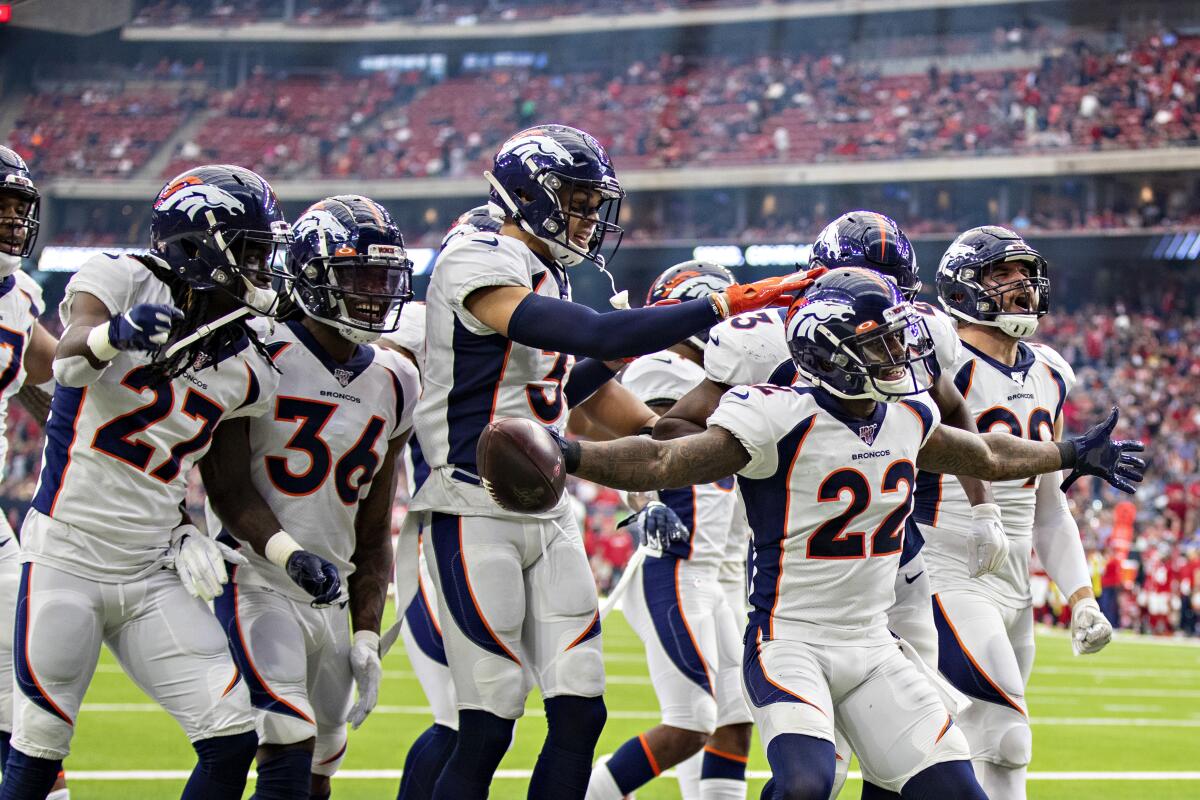 Denver Broncos cornerback Kareem Jackson celebrates an interception.